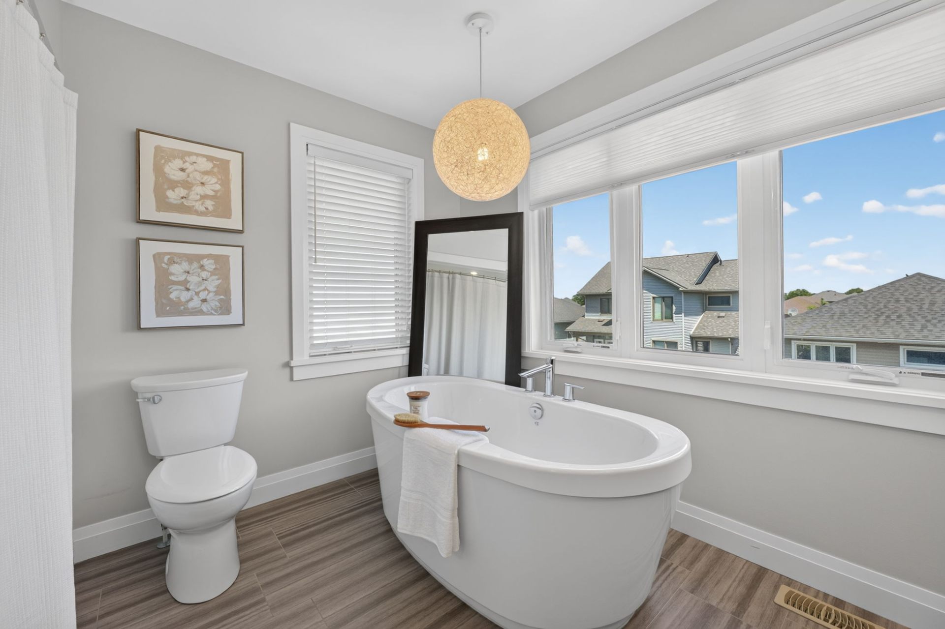 Primary ensuite with dual vanity and freestanding tub