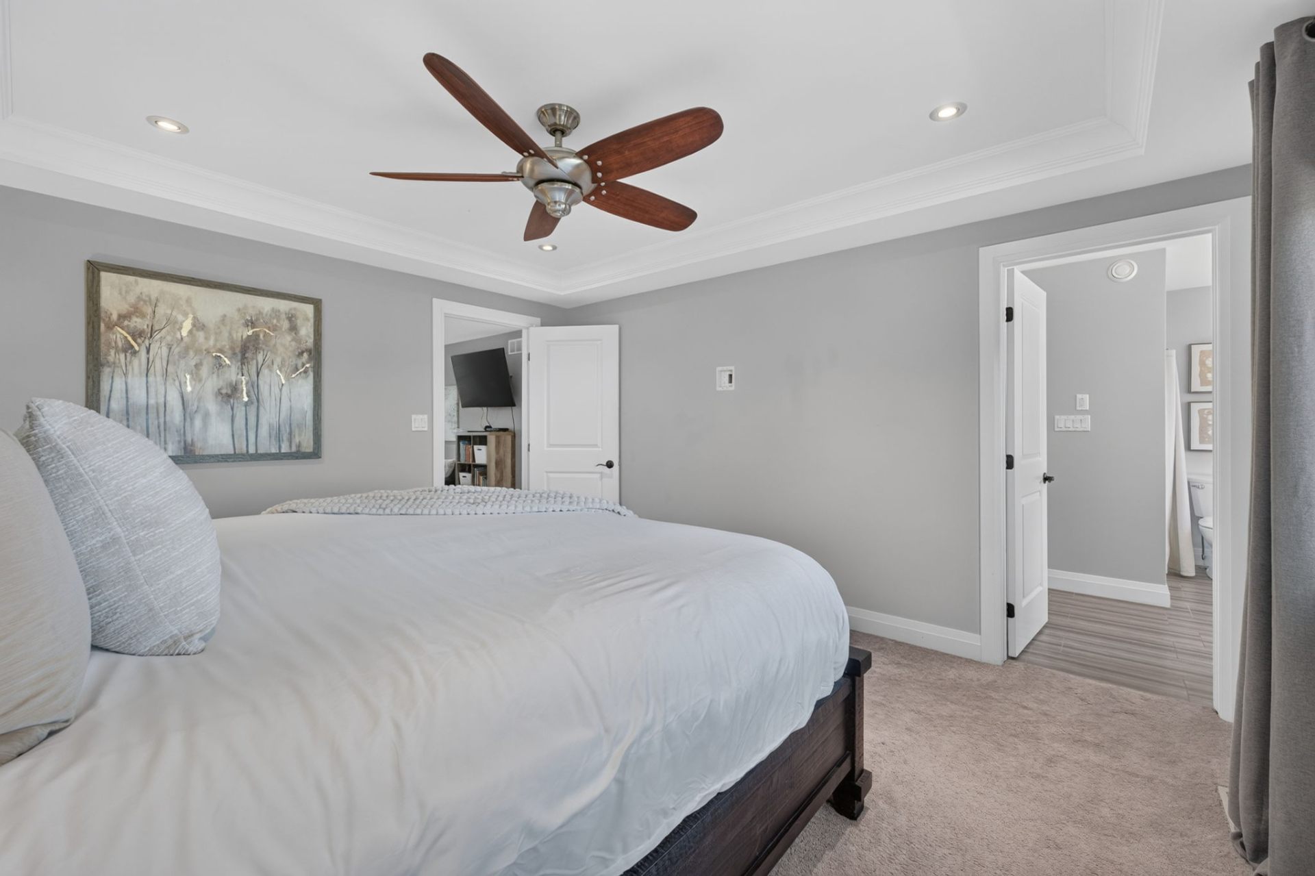 Primary bedroom with tray ceiling