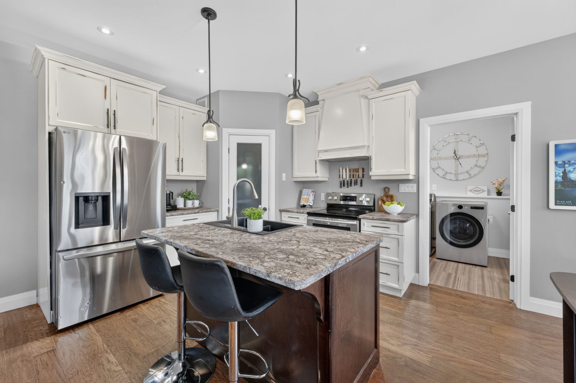Open concept kitchen with granite counters and breakfast nook